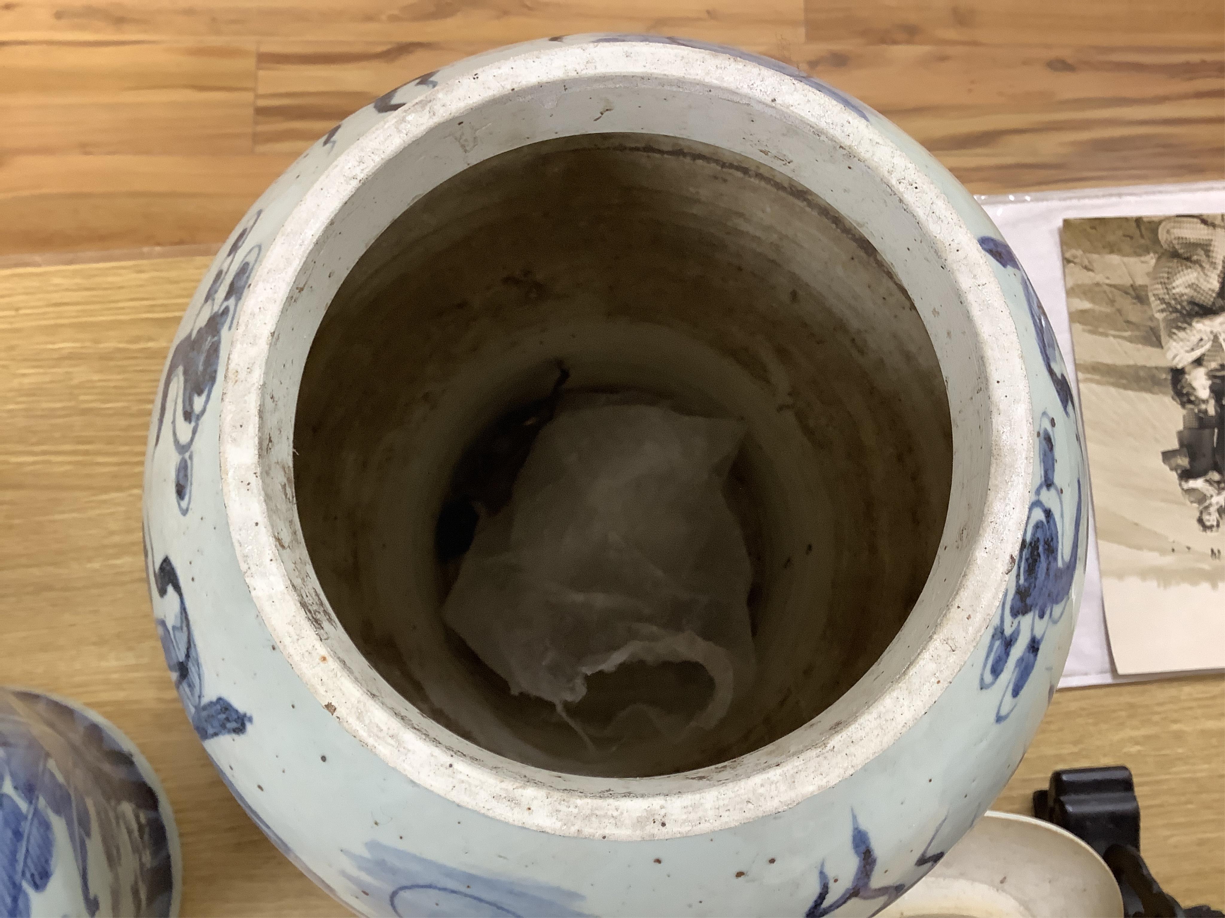 A pair of large Chinese blue and white ginger jars and covers, 54cm high. Condition - fair to good